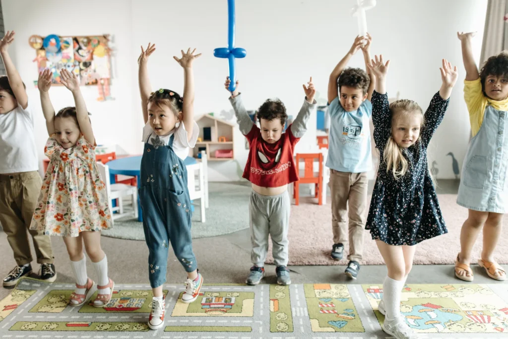 A cheerful childcare center environment with engaged children playing, showcasing interactive learning activities