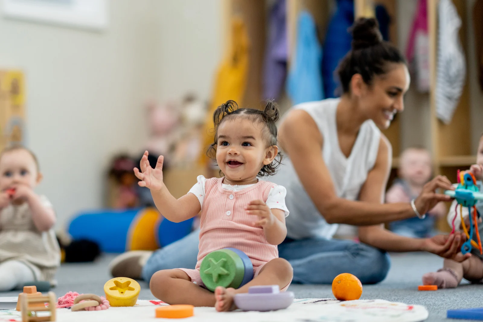 A bright and cheerful daycare center with children playing outside in a safe environment
