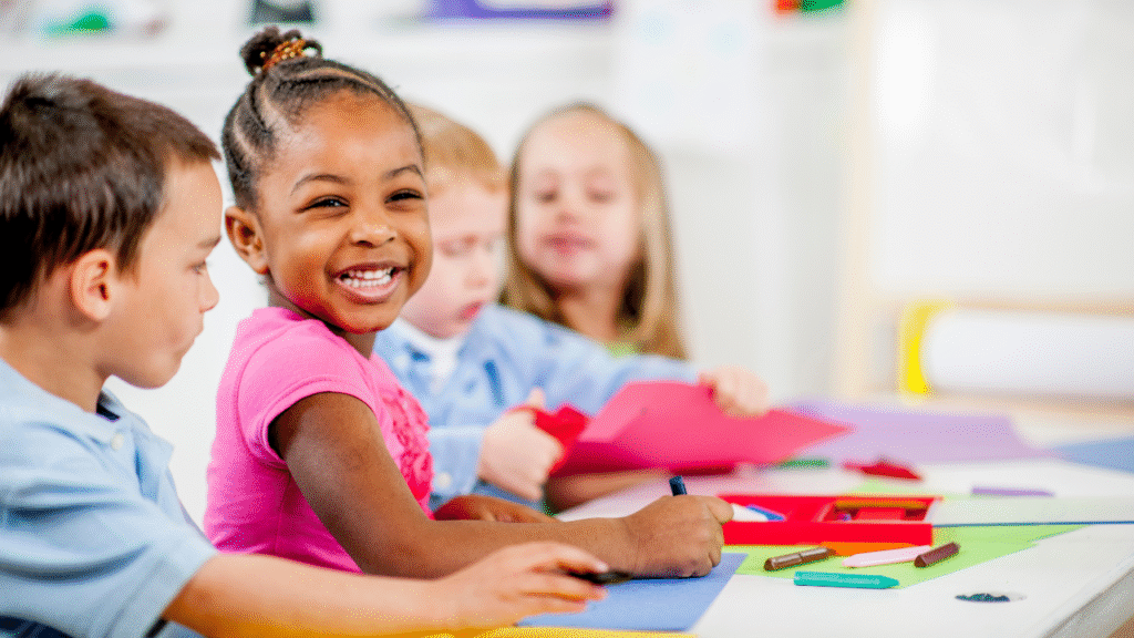 A happy child playing with toys in a colorful daycare environment