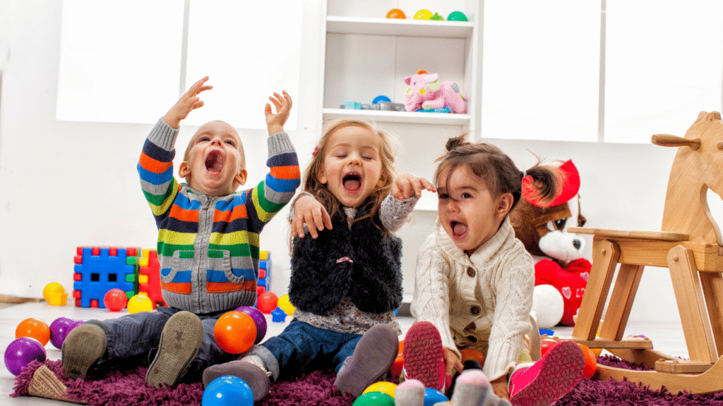 A cheerful scene of children playing in a vibrant daycare center with colorful toys and friendly staff